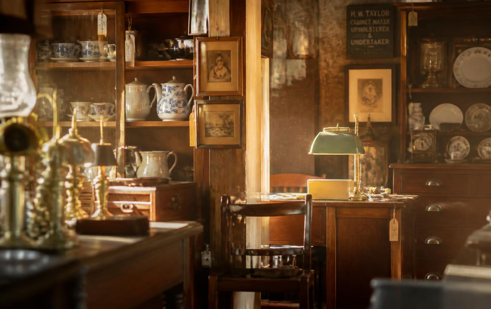 Inside TK Seconds & Antiques, filled with vintage furniture and brass pieces